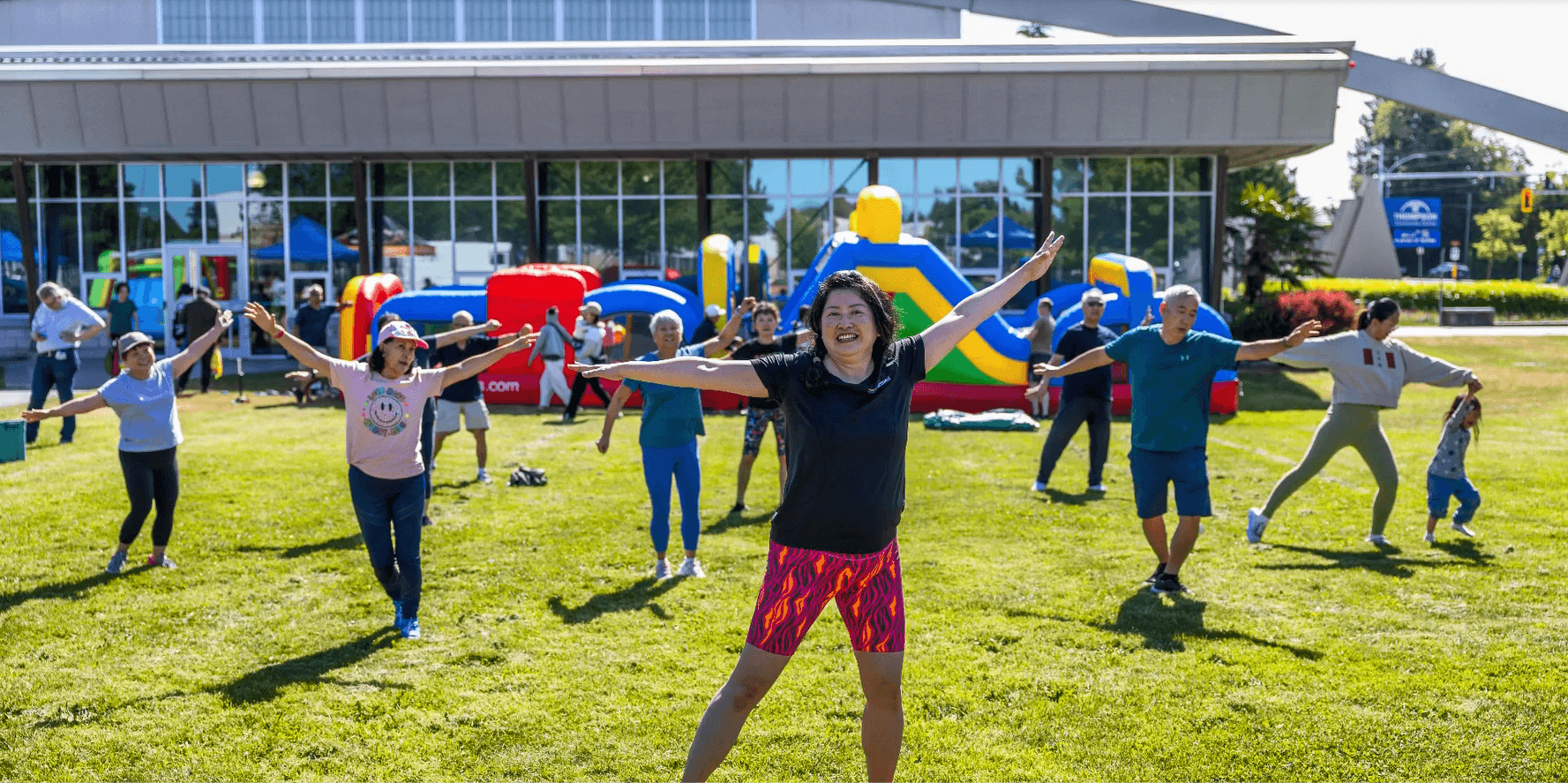 Group of people dancing outside a building