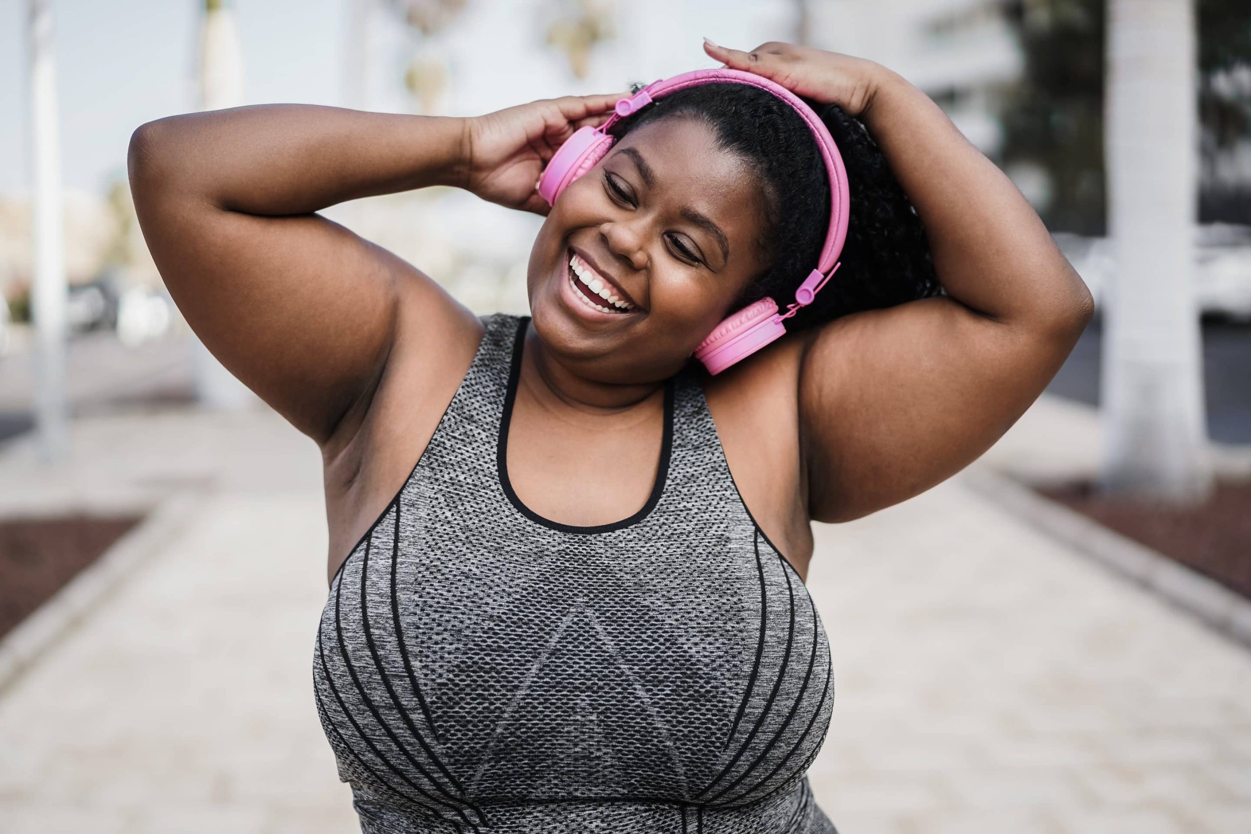 Woman smiling and dancing to get active