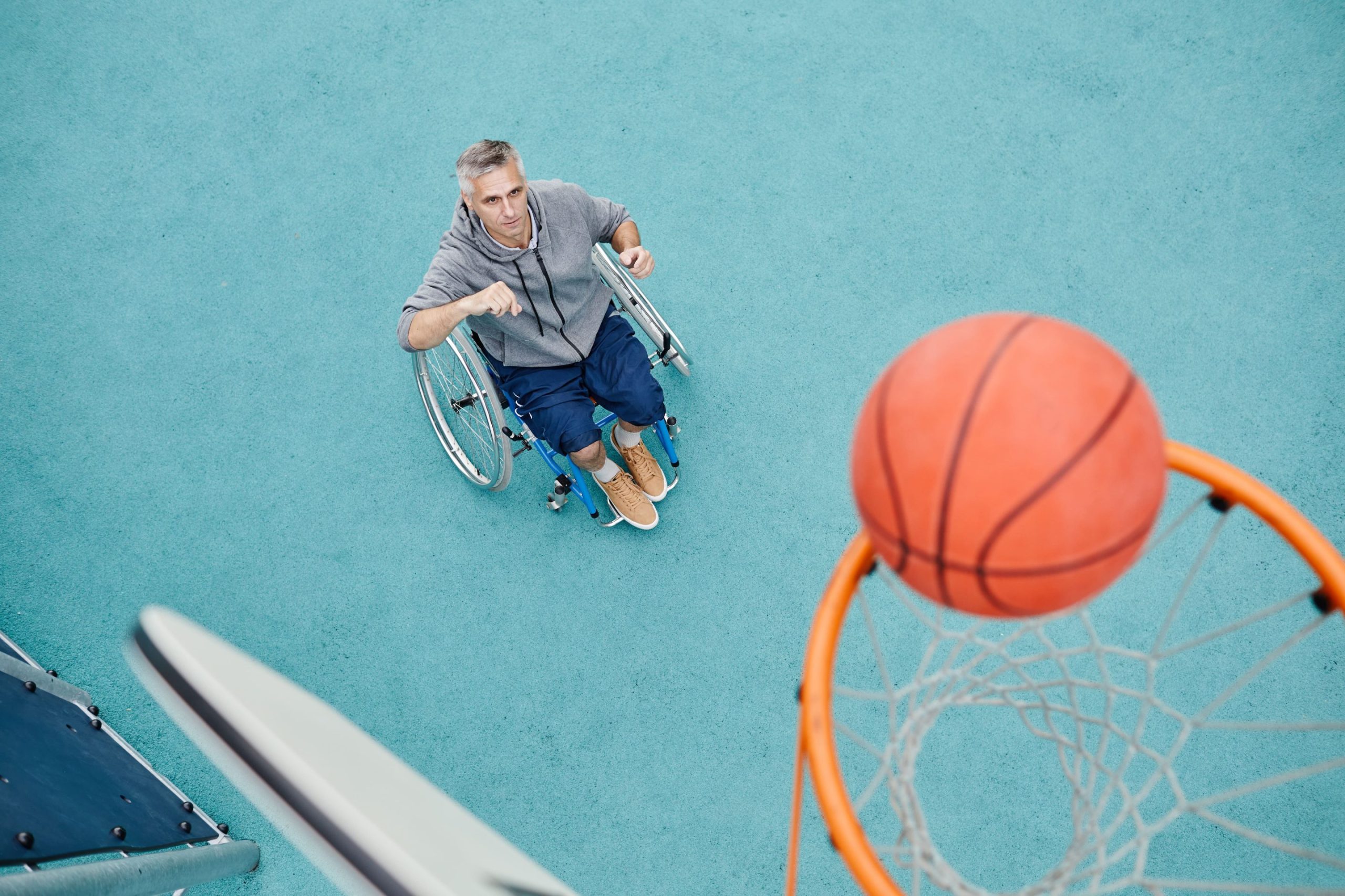 Man in wheelchair playing basketball