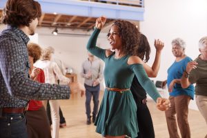 A group of people taking a dance class.